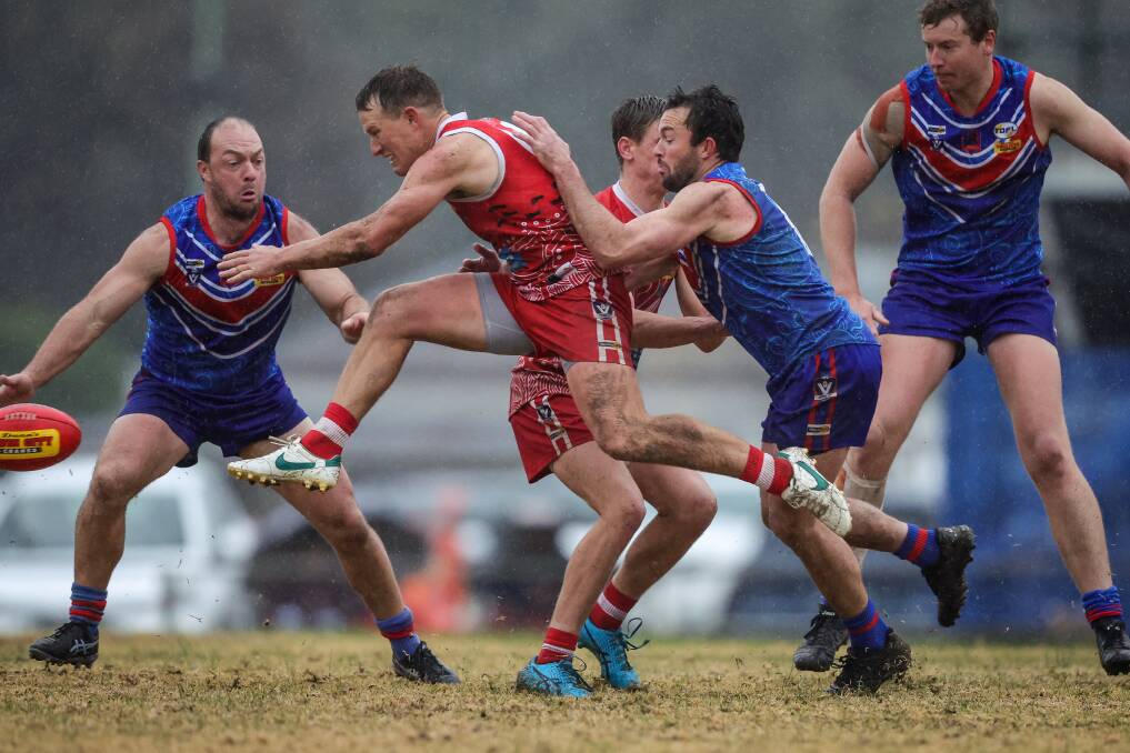 Chiltern coach Brad Hibberson disposes of the Sherrin as Tom Cartledge closes in. Picture by James Wiltshire