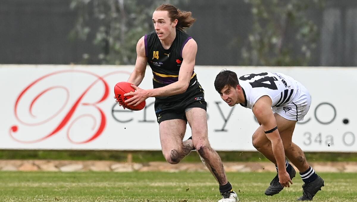 MAC TIME: Murray Bushranger Macca Hallows breaks clear of his Northern Knights opponent at W.J. Findlay Oval on Saturday. Picture: MARK JESSER