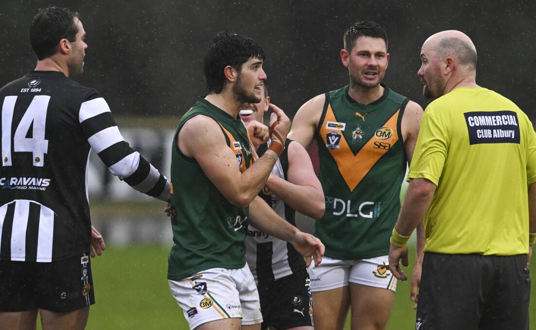 North Albury's Fletcher Ramage has a chat with the field umpire. Picture by Mark Jesser