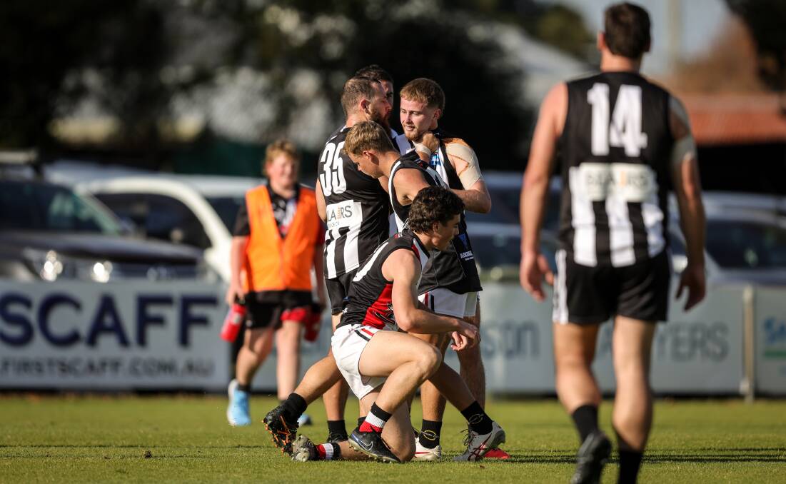 Murray Magpies' Hayden Edwards tries to bring teammate Rhys Pretious into line after some undisciplined play. Picture by James Wiltshire
