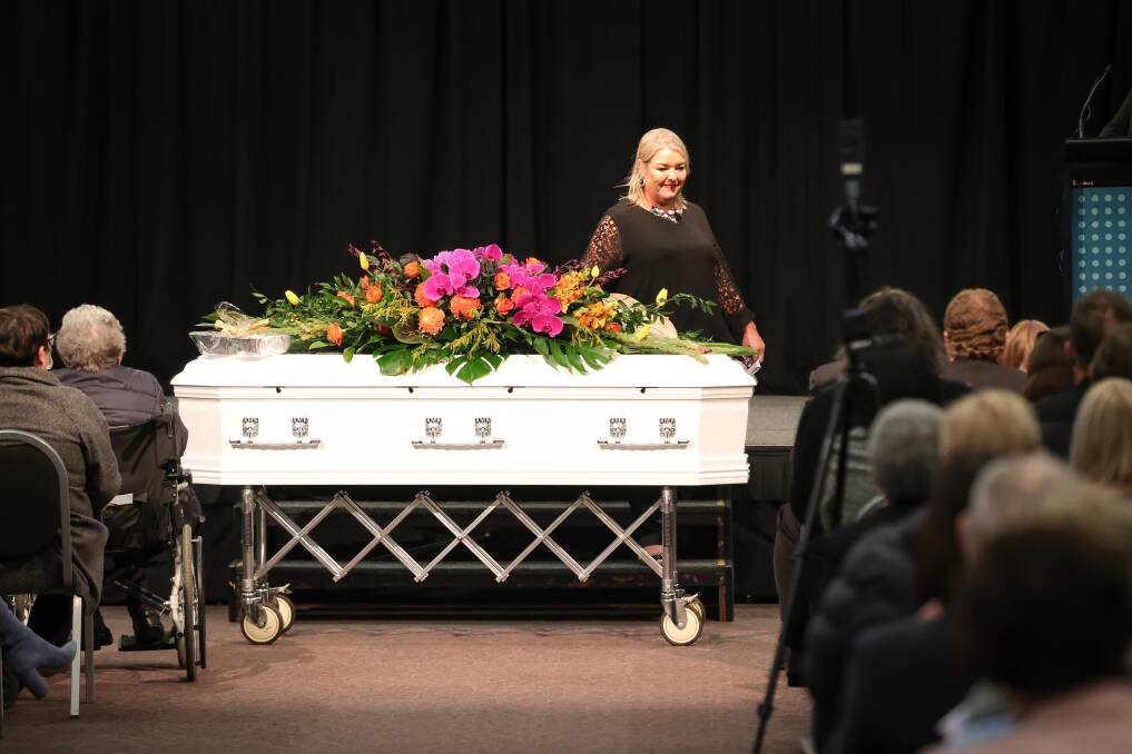 NEVER FORGOTTEN: Sharon Jacka's daughter Andrea Lever leaves the stage at Albury Entertainment Centre's banquet hall after a reflection on her mother's life. Mrs Lever said she was "blessed with the best mum you could imagine" at the funeral on Wednesday. Pictures: JAMES WILTSHIRE