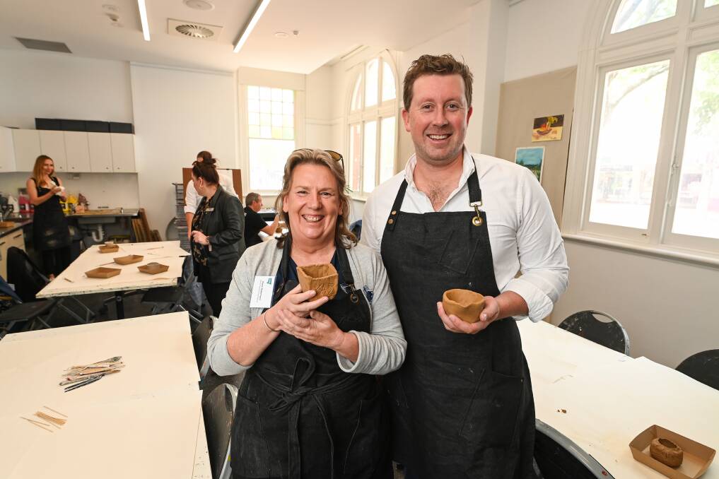 Albury Precision Engineering's Karen Habermann and Corowa Distilling Co's Dean Druce show off their sculptures made during a Business NSW event promoting tourism across the Border region at MAMA on Wednesday, October 25. Picture by Mark Jesser