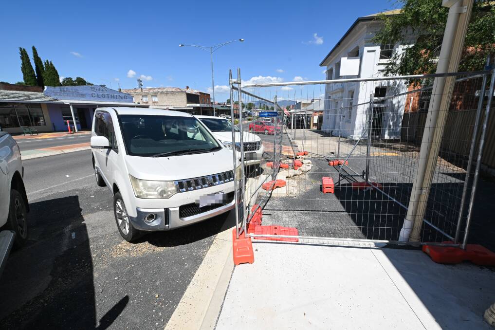 The footpath at the Donaldson Street end of Hanson Street in Corryong has been extended out to more than five metres from shopfronts, but will be reduced to create more space for parked cars. Picture by Mark Jesser