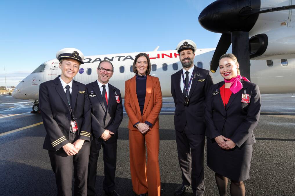 Mariah Jamie, Mick Murphy, QantasLink chief executive Rachel Yangoyan, Anthony Isaac and Briget Zizza in front of a Q400 aircraft which will be introduced to service Albury flights to Melbourne and Sydney. Picture by James Wiltshire