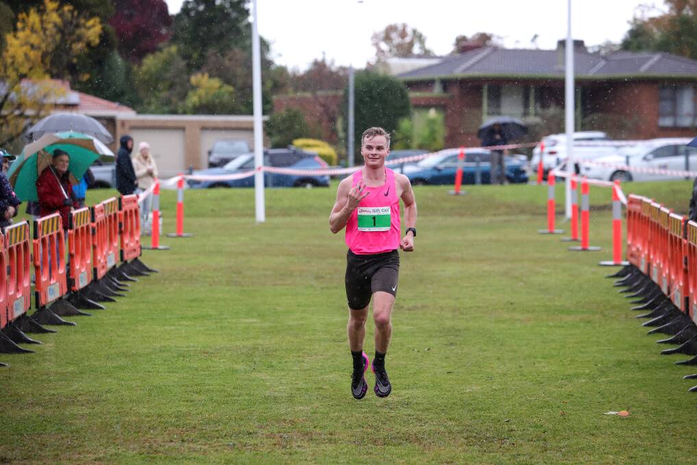 Paddy Stow salutes the crowd to mark a hat trick of Nail Can Hill Run titles. Picture by James Wiltshire