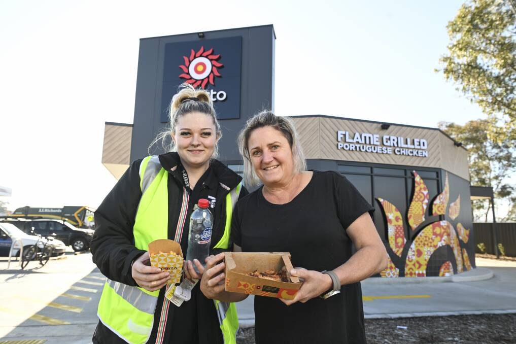 Managers of neighbouring businesses 7-Eleven and The Fast Lane Drive-Through Coffee Gemma Butler and Susan Hayes were excited for Oporto Wodonga to open on Melbourne Road on Friday, June 28. Picture by Mark Jesser