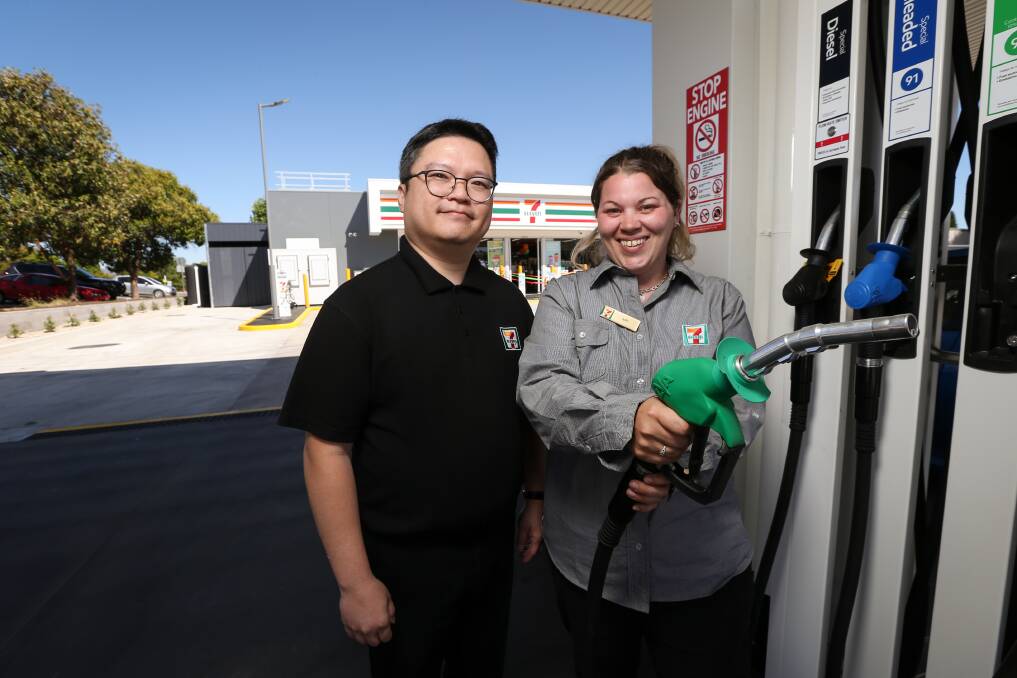 Operations performance member Tim Loi and store manager Amy Dosser at the opening of 7-Eleven on High Street. Picture by James WIltshire