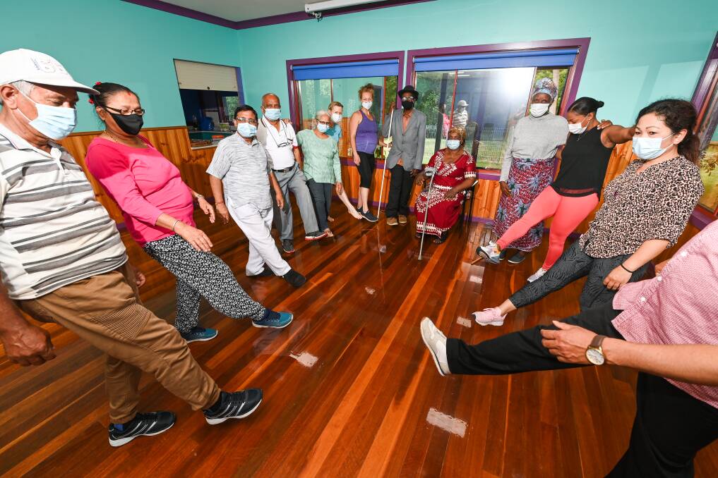 FITNESS AND FUN: Participants complete foot exercises as part of the Albury-Wodonga Volunteer Resource Bureau's final multicultural fitness class of 2021 in Albury on Wednesday. Picture: MARK JESSER 