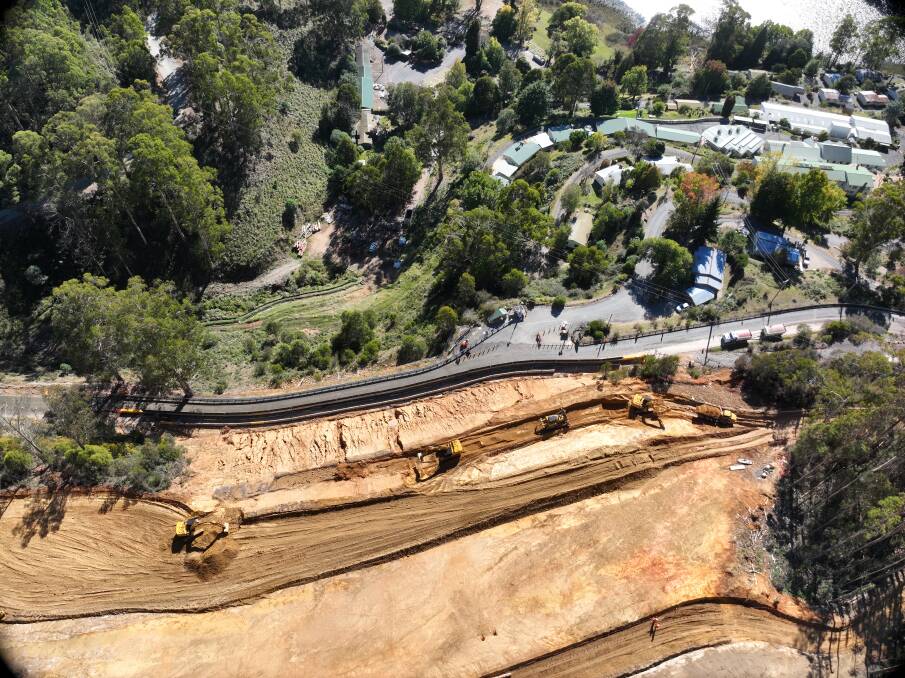 More than 600,000 tonnes of material has been excavated along a section of Bogong High Plains Road after a landslide in October 2022, above Bogong Village, to ensure it was open to two lanes of traffic in time for the 2024 ski season. Picture supplied