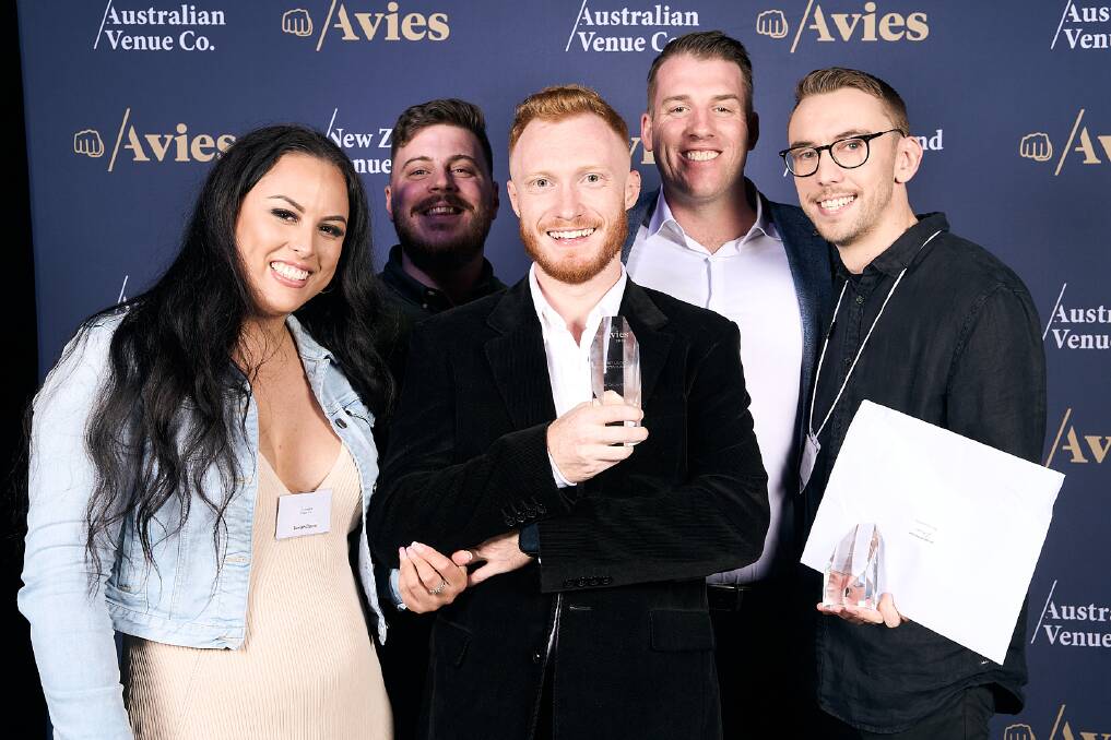 Albion Hotel venue manager Seriah Davis and Birallee Tavern venue manager Ben Pearce celebrate with Beer Deluxe Albury's entertainment manager Bryan Butterfield, senior operations manager Mitch Harris and venue manager Will Toole at The Avies in Melbourne. Picture supplied