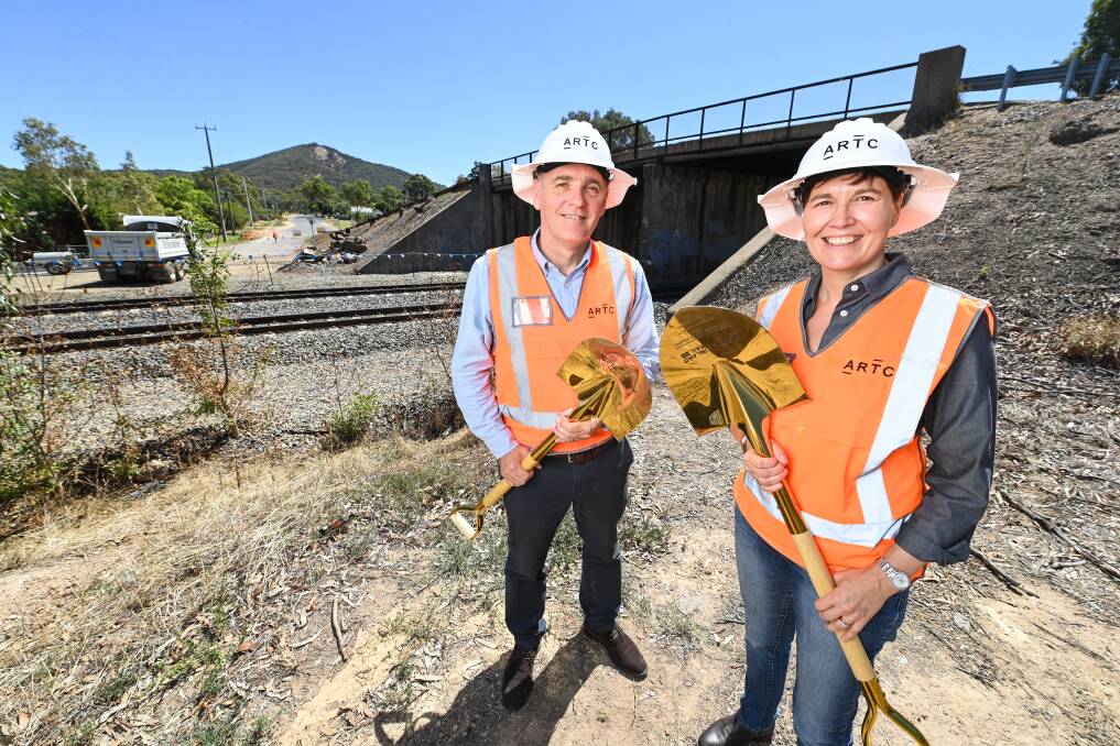 ARTC chief executive Mark Campbell and Inland Rail interim chief executive Rebecca Pickering mark the beginning of construction for the project in Victoria in February 2023, in front of Glenrowan's current rail bridge. Picture by Mark Jesser