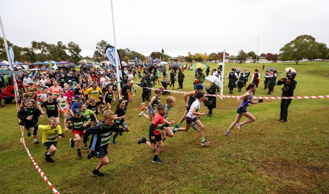 Competitors getting off to a strong start in the four-kilometre Half Can run in very wet conditions at Bonnie Doon Park. Picture by James Wiltshire