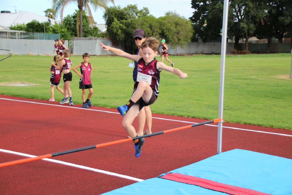 GREAT EFFORT: Wodonga under-eight athlete Eddie Evans nails the height in the high jump for Wodonga Little Athletics Centre on the weekend. Picture: RYAN MCMAHON