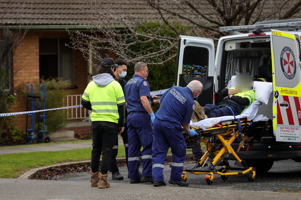 Paramedics loading a man into an ambulance on Schubach Street in East Albury on Monday, July 10. Picture by James Wiltshire