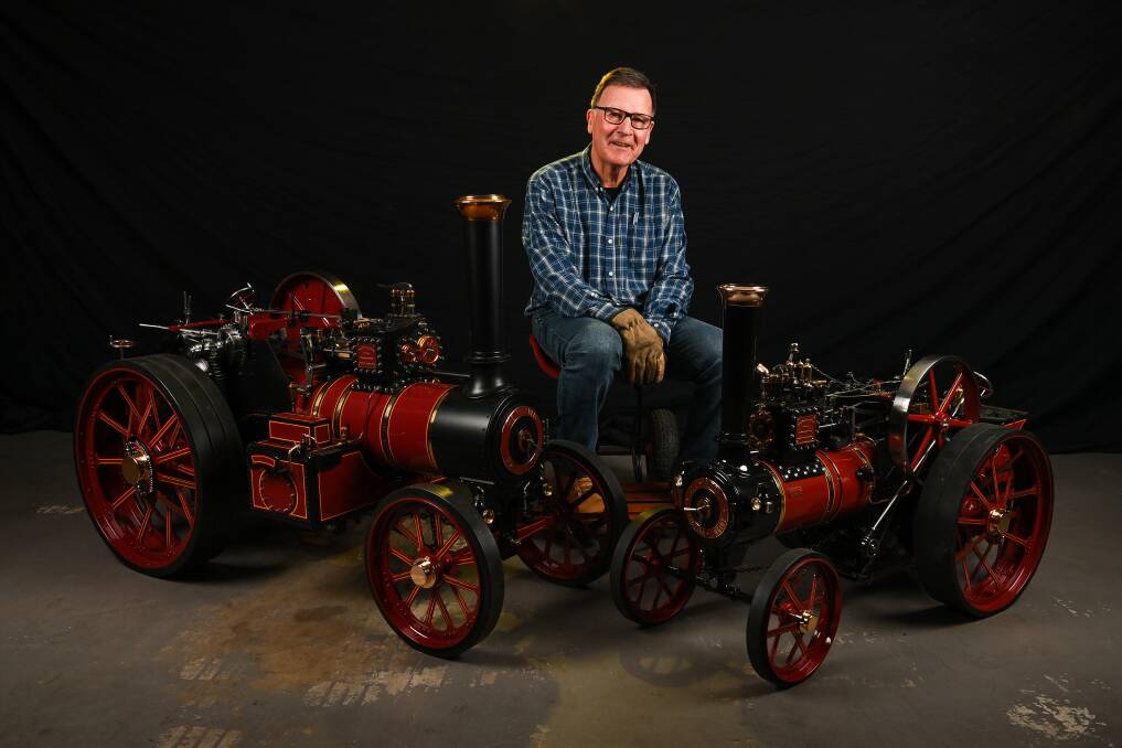 Wodonga's Glenn Roennfeldt sits with his two one quarter scale Burrell traction engines, built 17 years apart. Picture by Mark Jesser