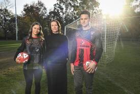 Centre Against Violence chief executive Jaime Chubb (centre) with Wangaratta City Football Club's Katarina De Napoli and Raul Pahina ahead of its Stand Against Violence match against Melrose FC at South Wangaratta Reserve on Sunday, July 7. Picture by Mark Jesser