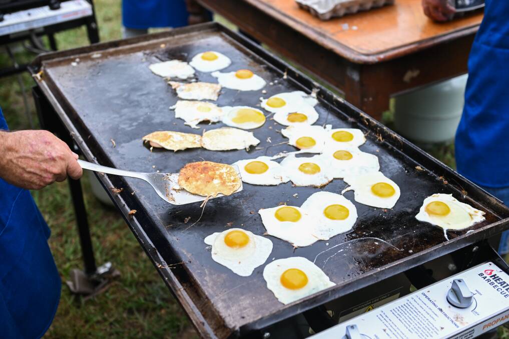 Volunteers flip eggs during the 2024 Greater Hume Council Australia Day celebrations. Picture by Mark Jesser