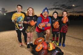 Leo Hoppe, 8, Lilly Thompson, 6, Auskick co-ordinator Darryl Carter, Vinnie Woodall, 5, and Audrey Hocking, 5, are part of a thriving junior football community in Baranduda. Picture by Mark Jesser