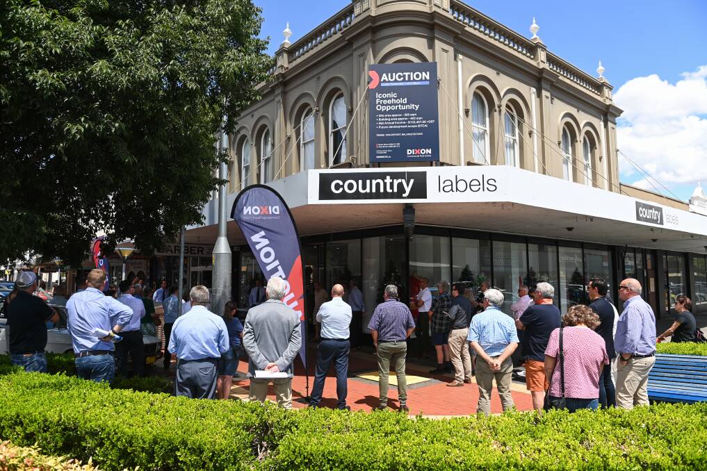 Onlookers line Dean and Townsend streets for the auction of the historic Beehive building in Albury on Friday, December 1. Picture by Mark Jesser