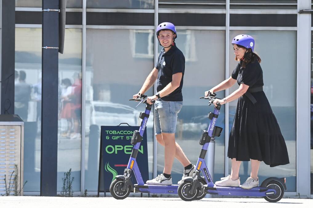 Beam NSW operations manager Ned Dale and Albury mayor Kylie King test out the e-scooters on December 15. Picture by Mark Jesser