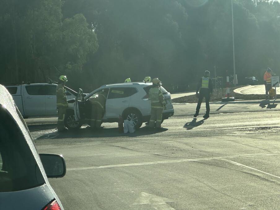 Emergency services assist a family out of a white Nissan involved in a crash on Baranduda Boulevard on Thursday, August 3. Picture by Sophie Else