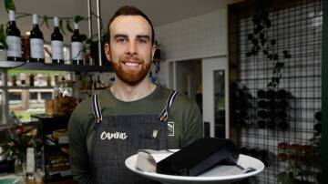 Canvas Eatery barista Lachlan Farrow with the EFTPOS machine used by the Albury cafe and restaurant. The business has recently transitioned to the 4G network before the 3G shutdown on August 31. Picture by Phoebe Adams 