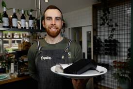 Canvas Eatery barista Lachlan Farrow with the EFTPOS machine used by the Albury cafe and restaurant. The business has recently transitioned to the 4G network before the 3G shutdown on August 31. Picture by Phoebe Adams 