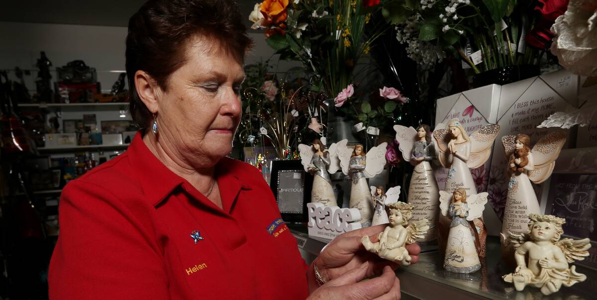 ANGEL OF MERCY: Helen Goldsworthy, at her Simple Indulgence gift shop in Wodonga, says she just couldn't leave the graveside keepsakes in the Garden Of Angels to be disposed of as part of the cemetery clean-up.