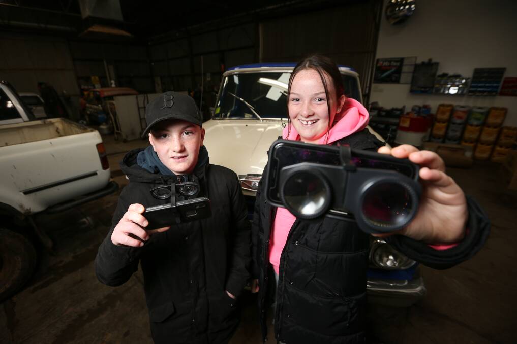 SEEING STARS: Henty twins Brock and Chanelle Cunningham, 12, took part in a virtual reality astronomy event from their dad's mechanic workshop. Saint Paul's Lutheran School was sent the headsets from the local library. Picture: JAMES WILTSHIRE