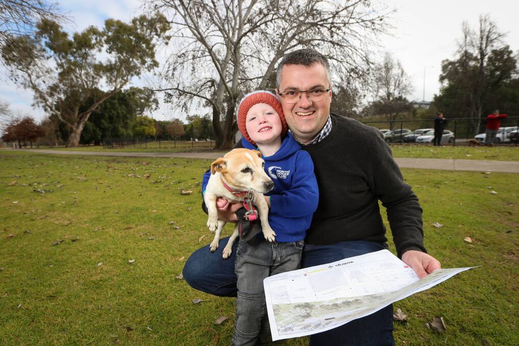 NEW SPACE: Wodonga mayor Kevin Poulton with son, Leo, 3, and Bubbles at the dog park at Sumsion Gardens, which will be upgraded. Council is asking residents for feedback on draft plans. Picture: JAMES WILTSHIRE