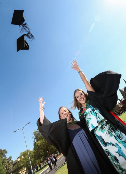 Bronwyn Hicks and Ashley Byrnes celebrate the end of their education bachelors. 