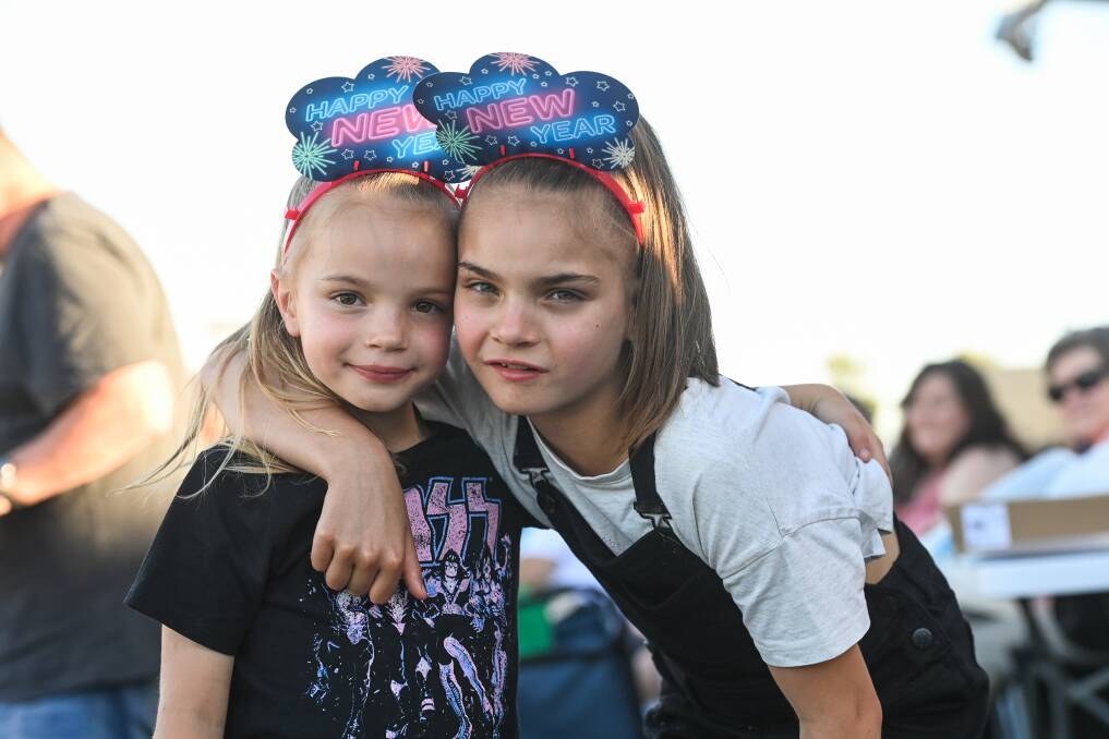 FAMILY AFFAIR: Lilly Doolan, 6, with sister Brie, 9, of Thurgoona, at the trots. They enjoyed the free rides on offer with family-friendly entertainment in focus.