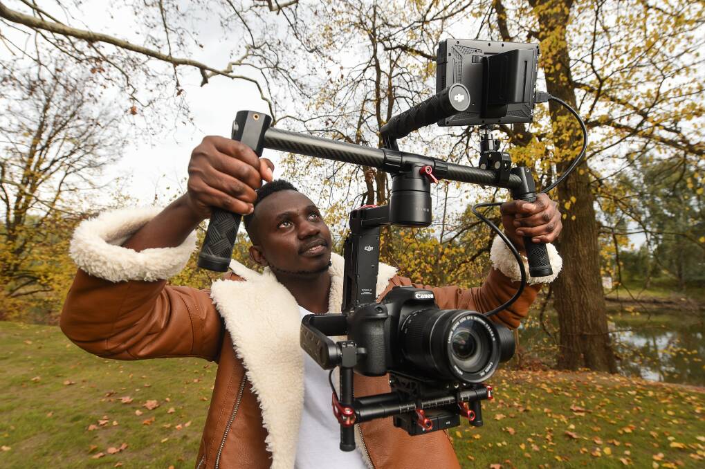 ACTION: Olivier Nzovu has created a film with AWECC for Refugee Week, which began on Sunday. The 22-year-old, who came to Wodonga 13 months ago, has interviewed 14 Border people about their experience. Picture: MARK JESSER