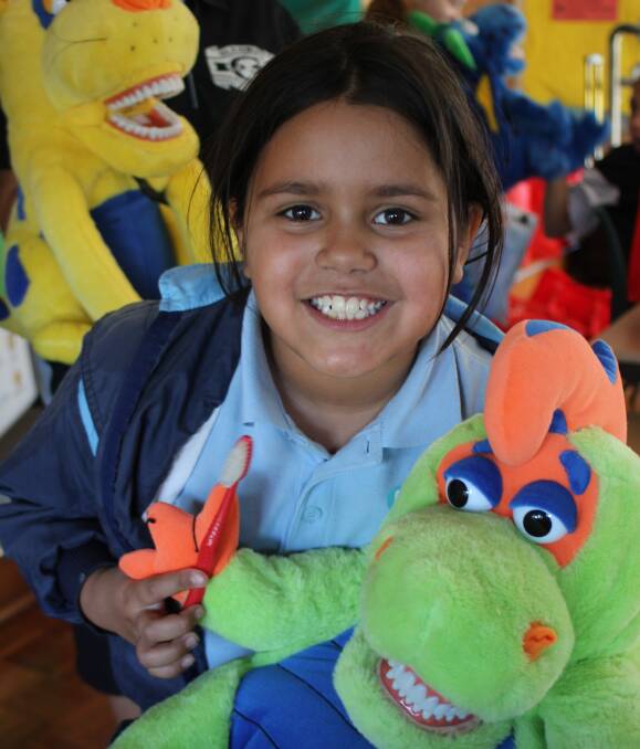 ALL SMILES: Glenroy Public School year 3 student Halle Murray, 8, took part in the Carevan Sun Smiles program. Founder John Brabant is pushing for funding to take the program state-wide. Picture: LOUISE PHEGAN
