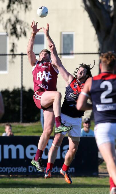 SKYWARD: Wodonga's Sam Maher elevates against Raiders recruit Duncan Proud. The pair had an engaging contest throughout the afternoon. Picture: John Russell