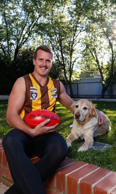 READY TO GO: A grand final in brown and gold has been a long time coming for Kiewa's Peter Winnett, pictured with his dog Baxter. Picture: MARK JESSER