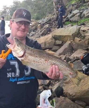 NICE OLD CATCH: Nick Hutchinson landed this cracking brown trout while fishing the Murray River near Albury recently. It weighed in at 2.1kg. Picture: Supplied