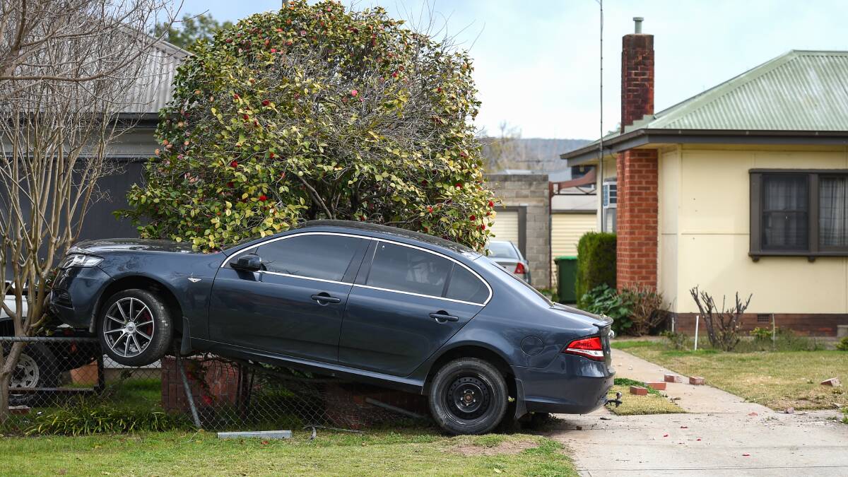 North Albury resident awoken to find car sitting on his front fence ...