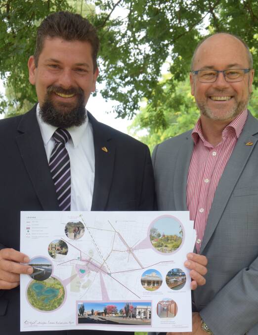 CELEBRATING: Indigo Shire mayor James Trenery, left, and chief executive officer Gerry Smith with the Rutherglen revitalisation project plans.
