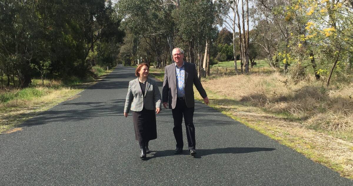 MISSION COMPLETE: Liberal candidate Sophie Mirabella and Indigo mayor Bernard Gaffney at Sanitorium Road near Yackandandah which was one of three upgraded with $1.8 million of federal funding.
