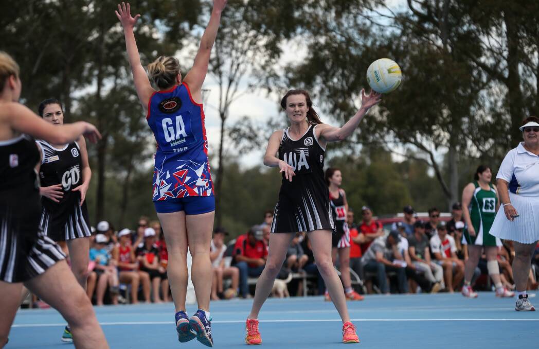 
BIG VICTORY: Jindera's Jessica Guy defends Magpies' Tegan Vogel as she passes to a teammate during the preliminary final on Saturday. Picture: JAMES WILTSHIRE