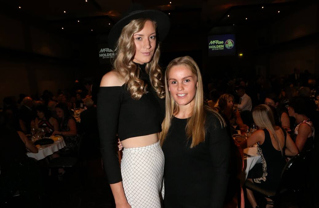 Black and white: Amanda Umanski in print pants, a hat and a shoulder-baring crop with teammate Issy Byrnes from Wangaratta Magpies.