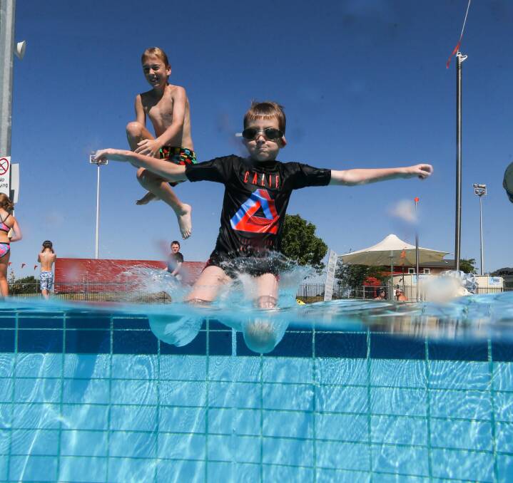 COOL WATER: Josh Gorman,11, and his brother Nicolas,8, from Lavington make the most of school holidays by jumping in to the water at Albury. Pictures: JAMES WILTSHIRE