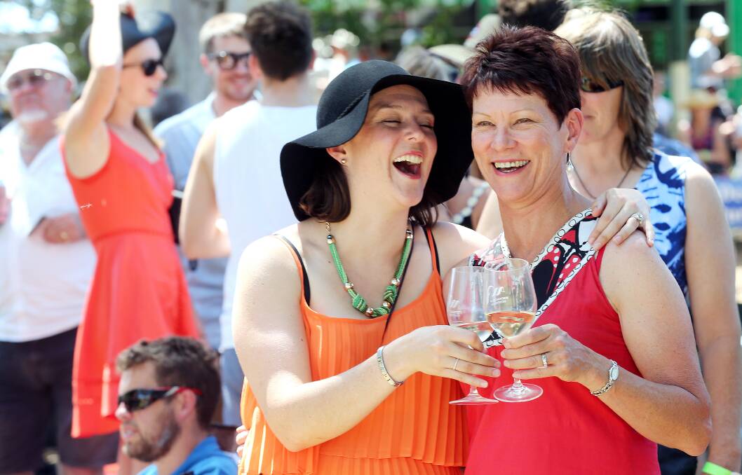 COMMUNITY EVENT: Bridget McIlroy and her mother Rose McIlroy share a laugh at the Dederang Picnic Races last year. Picture: JOHN RUSSELL