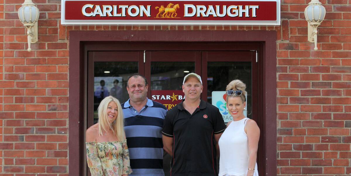 GOOD RUN: Co-Owners Cherrene Newton and her husband Andrew with Simon Hodgson and his wife Leanne who have spent 13-years running the Star Hotel. Picture: BLAIR THOMSON