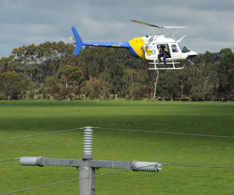 Flying low: The AusNet helicopter which will fly over the North East to check electrical equipment ahead of bushfire season. Picture: SUPPLIED