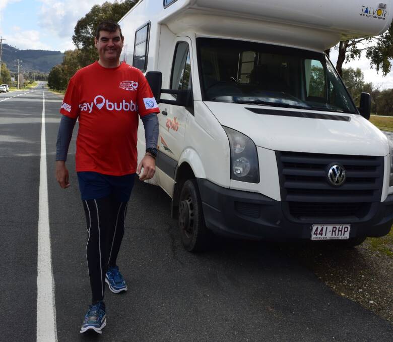 RAISING MONEY: There's a long road ahead for Gary Wilmot who walks along McKoy Street on his way across the country from Perth to Brisbane raising money for the Heart Foundation. Picture: TAHLIA MCPHERSON