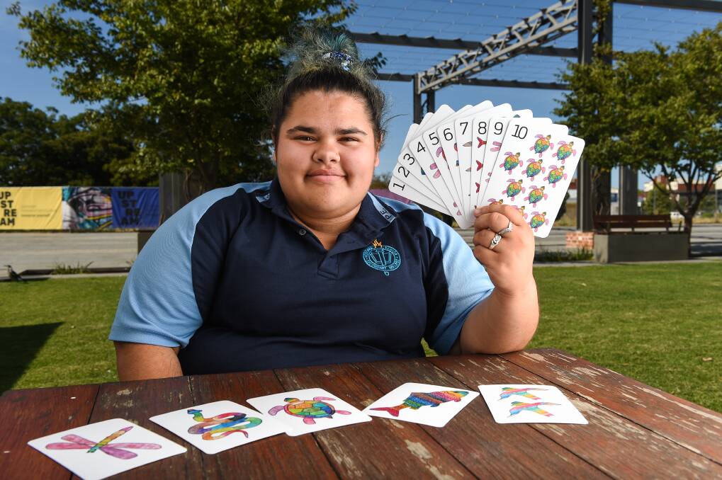 PASSION: Carliegh Walsh, 16, was commissioned to design some educational cards for preschools in the Wodonga council area and hopes to continue encouraging learning through art. Picture: MARK JESSER