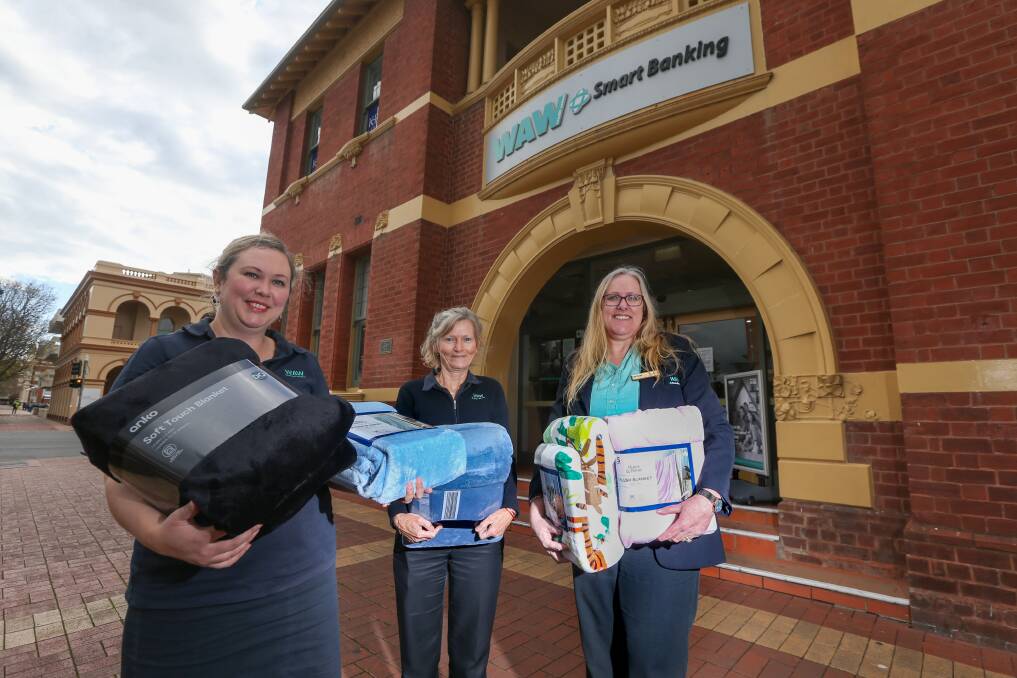 MORE NEEDED: WAW Albury's Lucy McEwan, Wendy Stan and Joanne Amos with some blankets that have been donated. Picture: TARA TREWHELLA