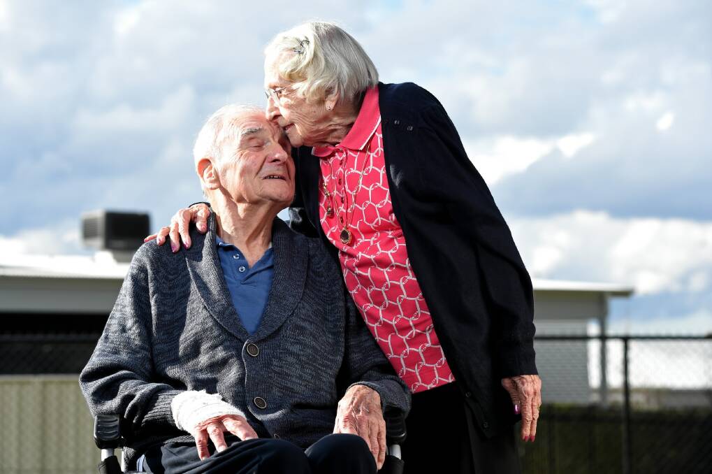Wally Cuss and his wife Audrey shared a kiss to commemorate their 70th wedding anniversary. Picture: MARK JESSER